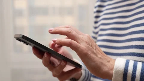 Woman's hands using a smartphone Stock Footage 288874029