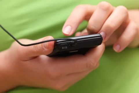 Woman's hands using a smartphone Stock Photos