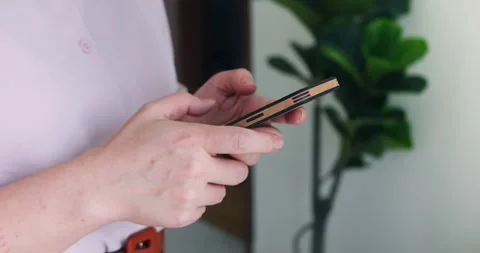 Woman's hands using text messages on a mobile phone or chatting. Close-up of a Stock Footage 284939005