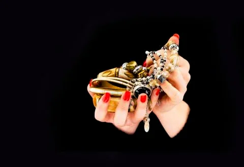 Woman's hands with various bracelets Stock Photos