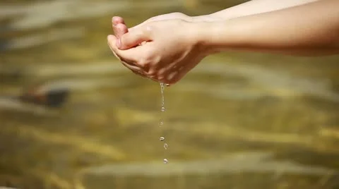Woman's hands with water splash Stock Footage
