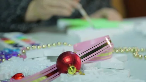 Woman's hands in the winter evening makes home decorations for Christmas Stock Footage 140472996