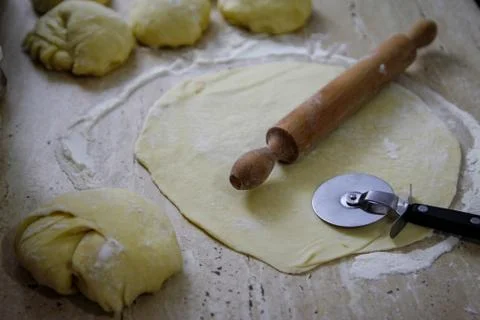 Woman's hands work with dough in the kitchen Stock Photos