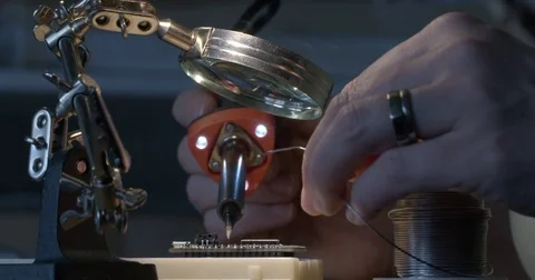Woman's hands working with electronics on small circuit board 4K Stock Footage 84959853