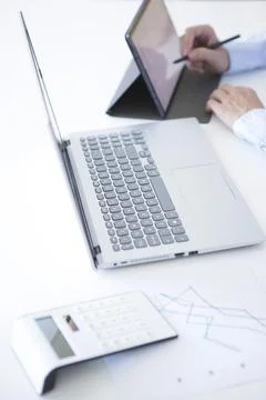 Woman's hands working with her tablet in her office Stock Photos