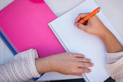 Woman's hands writing on a paper Foto stock
