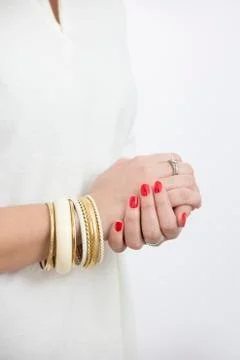 Woman's hands with yellow bracelets Foto stock