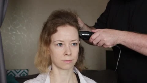 Womans Head Shave During Illness, Personal Battle with Disease and Hair Loss Stock Footage 313751546
