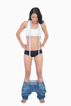 Womans jeans falling down because shes lost weight Photos