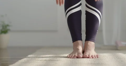 Woman's legs and arms doing yoga Stock Footage 100943293