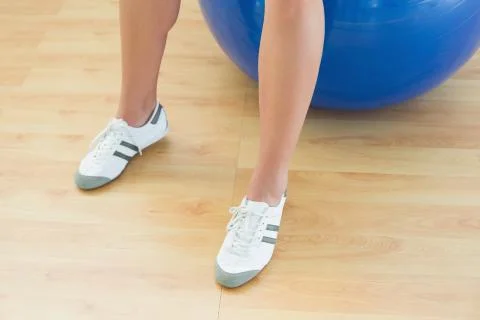 Woman's legs and exercise ball Stock Photos