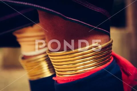 Woman's legs in bracelets Long Neck tribal . Tribal village Thailand. Stock Photos