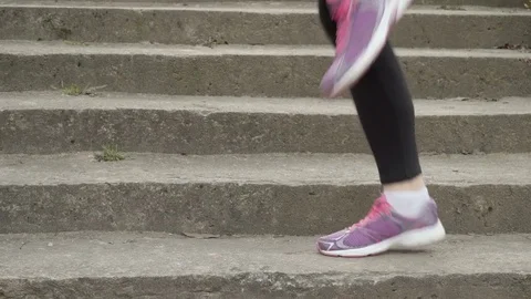 Womans legs run on the spot Stock Footage 74008500