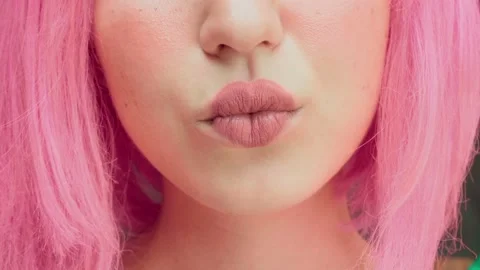 The woman's lips are painted in the shape of a heart. Extreme close-up Vídeo Stock 138783713