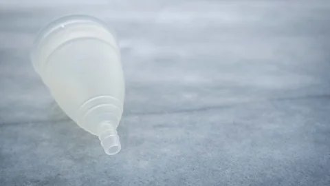 Woman's Menstrual Cup Falls and Bounces in Slow Motion Stock Footage 102868616