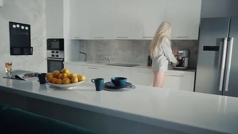 Woman's morning routine in the kitchen 스톡 동영상 84604126