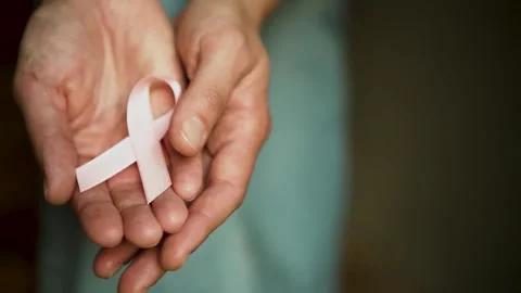 Womans Open Hands Presenting Pink Breast Cancer Awareness Ribbon Stock-Footage 317041784