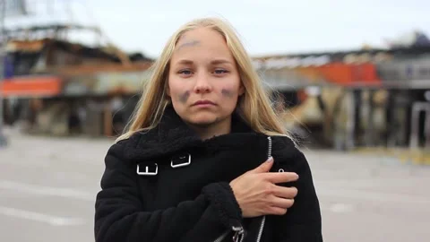Woman's portrait against the background of a destroyed building Stock Footage 211062425