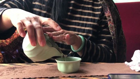 Woman's Serves Tea Stock Footage 105190103