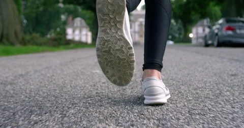 Woman’s sneakers running close-up Stock Footage 77078677