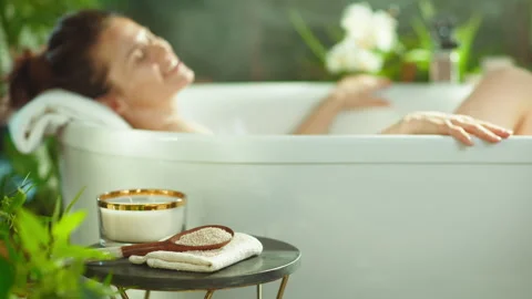 Woman's Tranquil Bath with Candle Light Stock Footage 316076746