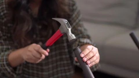 Women adjusting or repair assembling chair Furniture at home diy concept. Video stock 246778294