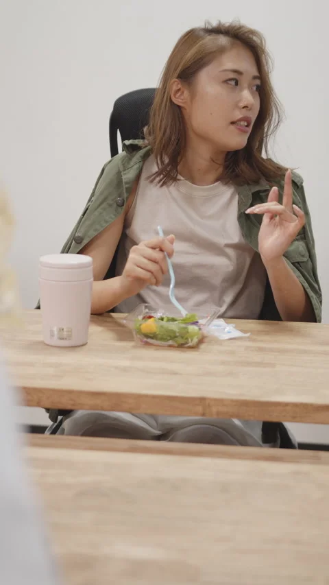 Women and male speaking while eating a lunch box Stock Footage 161921453