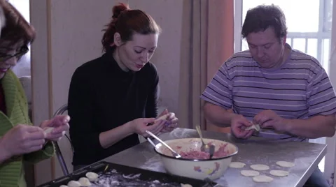 Women and men shape the dumplings Stock Footage 59191744