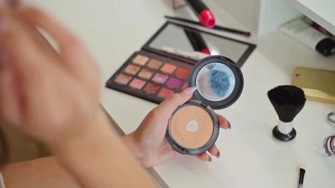 Women applying make up on herself Stock Footage 322202093