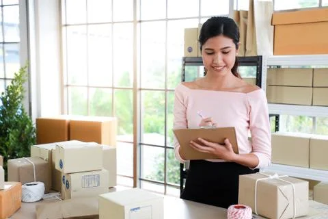 Women are write note of orders in concept of sme,e - commerce business. Stock Photos