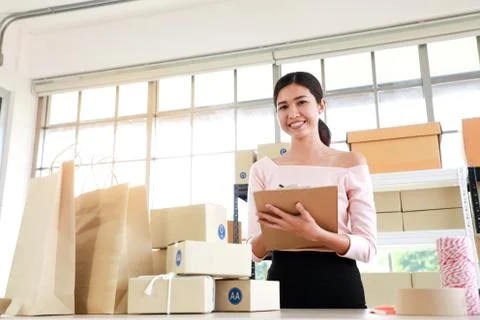 Women are write note of orders in concept of sme,e - commerce business. Stock Photos