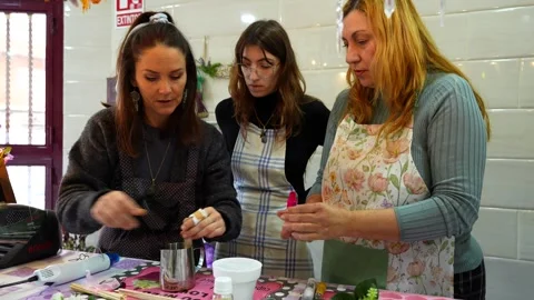 Women attending a candle making workshop together Stock Footage 334632783