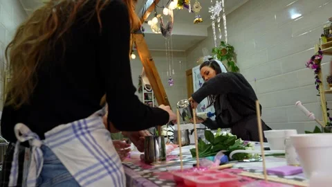 Women attending a creative candle making workshop Stock Footage 334555152