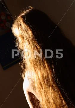 Women back with sunlight on red hair Stock Photos
