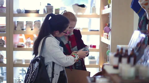 Women browsing together in store Stock Footage 63280722