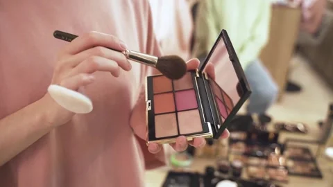 Women checking blushing make up kit Stock Footage 322202078