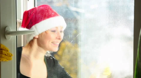 Women cleaning a window Stock Footage 31750651