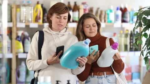 Women client scans QR code on package and downloads promo code to purchase Stock Footage 310067646
