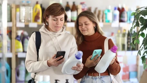 Women client scans QR code on package and downloads promo code to purchase Stock Footage 327136039