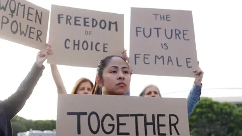 Women crowd protesting for gender equality - Feminist activism and social Stock Footage 317353148
