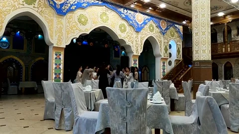 Women dancing and celebrating inside a traditional Uzbek restaurant in Samarkand Stock Footage 336846217