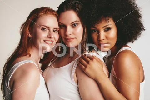 Women of different size in white tank top Stock Photos