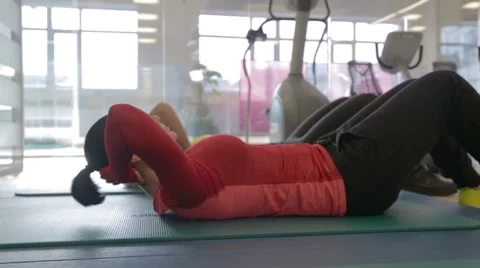 Women doing abdominal exercise Stock Footage 48656809