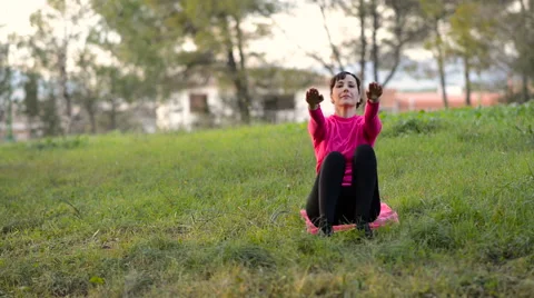 Women doing abdominal exercise workout outdoors Stock Footage 59535643