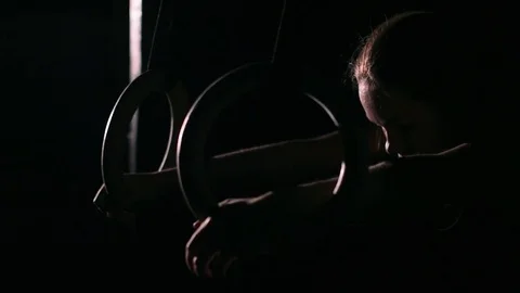 Women doing ring dips and working hard in the gym Stock Footage 70470975