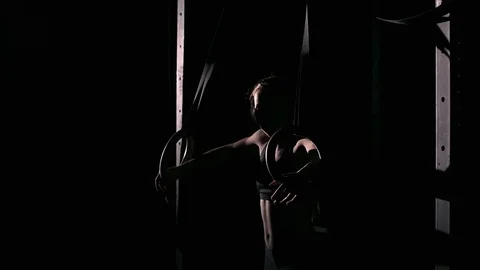 Women doing ring dips and working hard in the gym Stock Footage 70471081