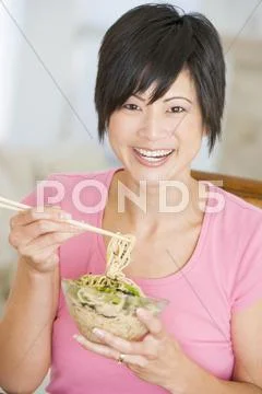 Women eating meal,mealtime with chopsticks Stock Photos