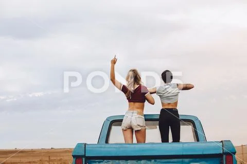 Women enjoying themselves on road trip Stock Photos