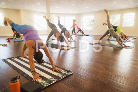 Women exercising yoga Stock Photos