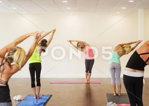 Women exercising yoga Stock Photos